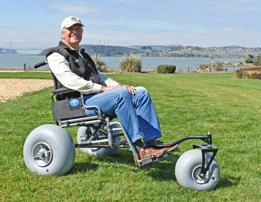 Man in beach converted wheelchair